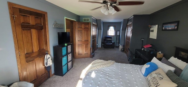 bedroom with dark colored carpet and ceiling fan