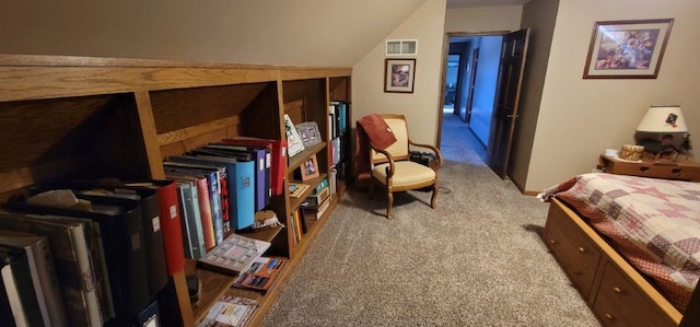 carpeted bedroom with vaulted ceiling