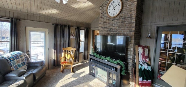 carpeted living room with ceiling fan, wooden ceiling, and lofted ceiling