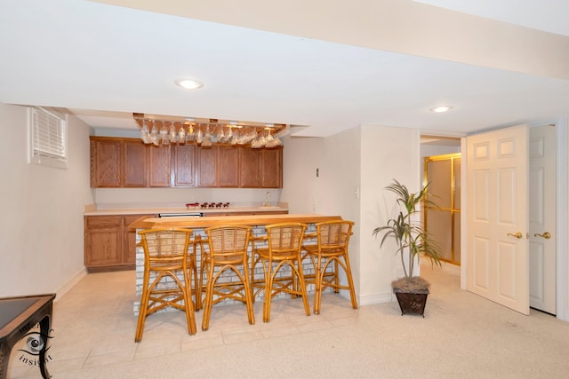 kitchen with light colored carpet