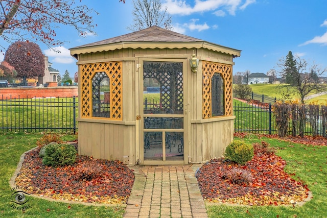 view of outbuilding with a lawn