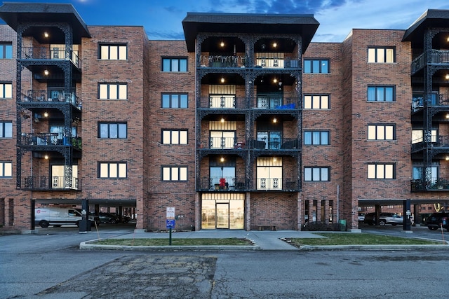 view of outdoor building at dusk