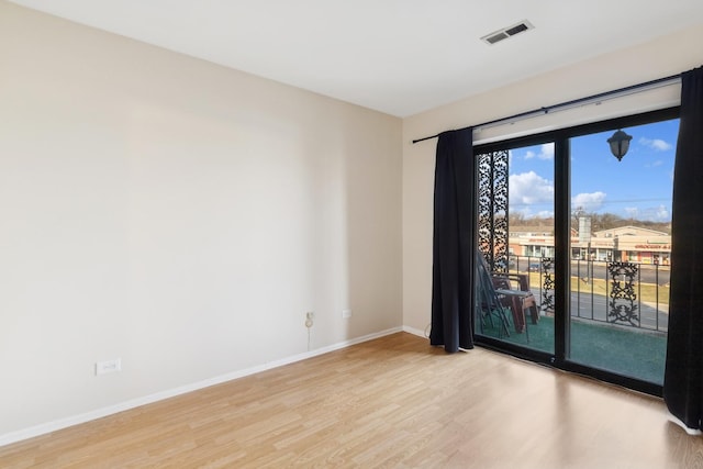 unfurnished room featuring light wood-type flooring