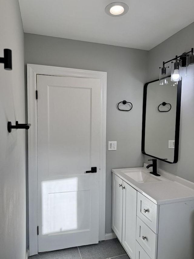 bathroom featuring tile patterned flooring and vanity