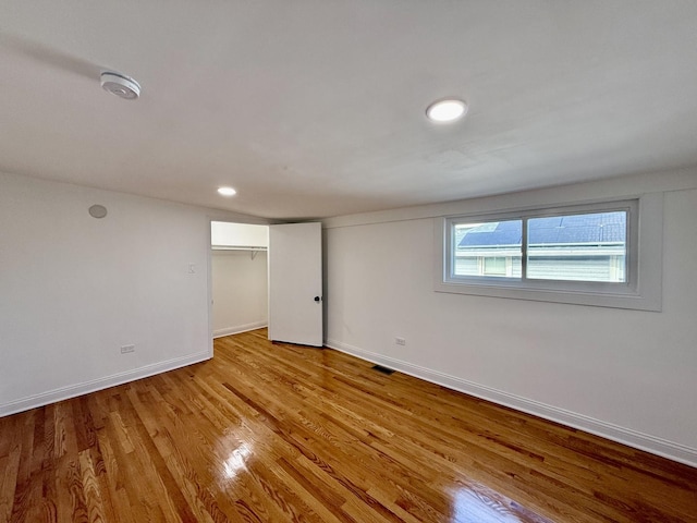 interior space with a closet and light hardwood / wood-style flooring