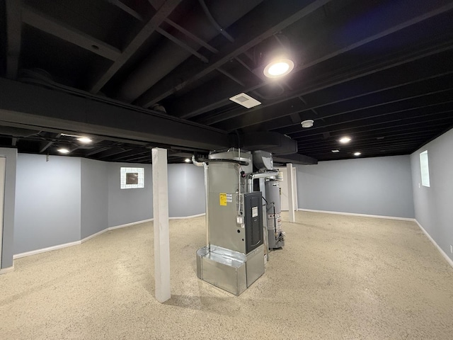 basement with heating unit and water heater