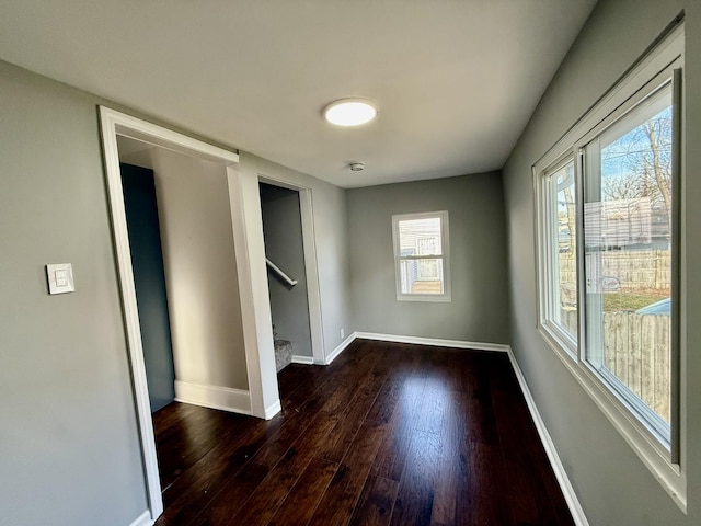 empty room featuring dark hardwood / wood-style flooring