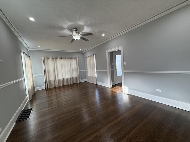 empty room with dark hardwood / wood-style floors, ceiling fan, crown molding, and a textured ceiling