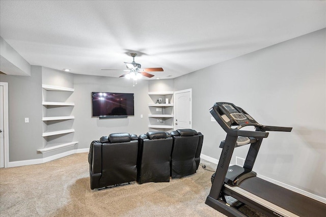 exercise area with carpet and ceiling fan