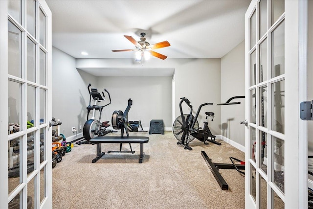 exercise room featuring carpet flooring, french doors, and ceiling fan