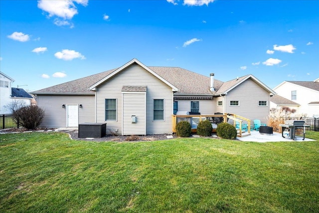 back of property featuring a patio area and a yard