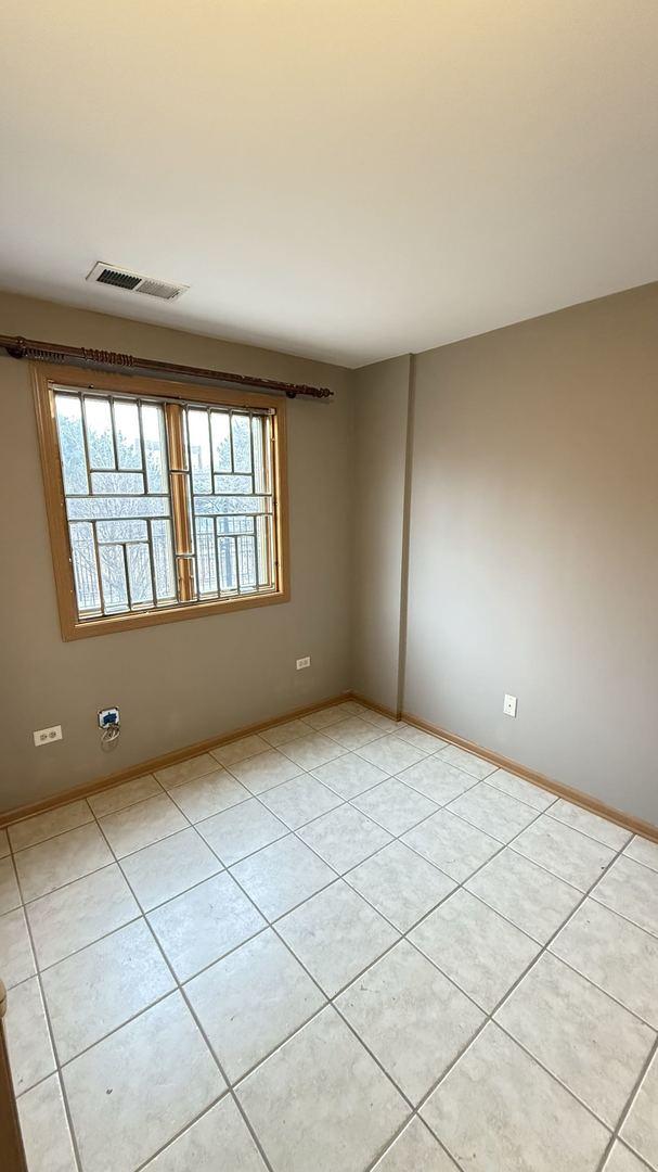 view of tiled spare room