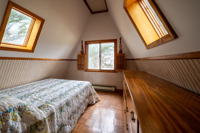 bedroom featuring light parquet flooring, a baseboard radiator, wooden walls, and vaulted ceiling with skylight