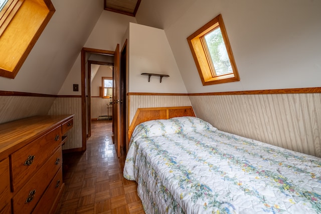 bedroom featuring dark parquet floors and a skylight