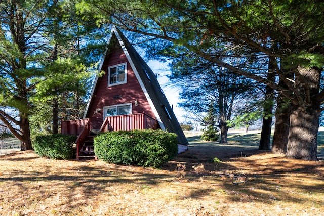 view of side of home featuring a deck