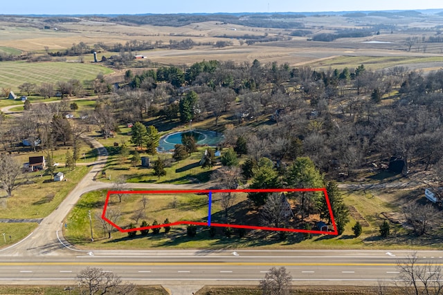 birds eye view of property featuring a rural view