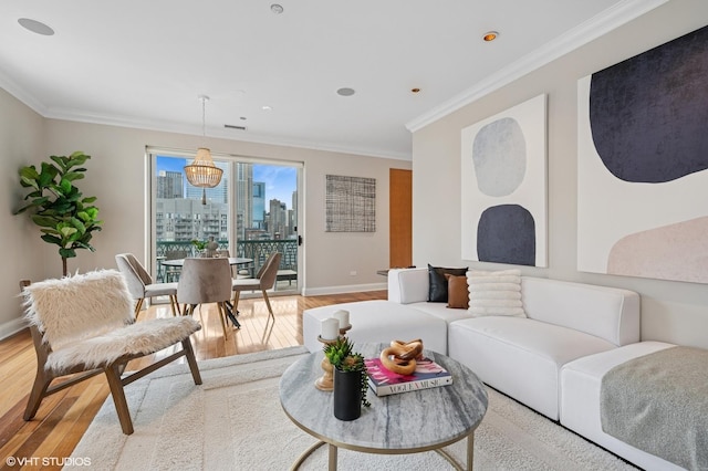 living room featuring a view of city, light wood finished floors, and ornamental molding