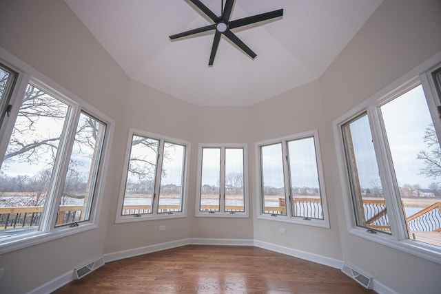 unfurnished sunroom with vaulted ceiling and ceiling fan