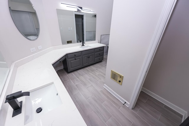 bathroom featuring vanity and hardwood / wood-style flooring