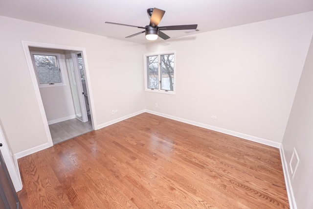 unfurnished room with ceiling fan and light wood-type flooring