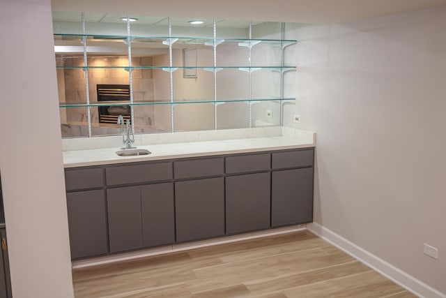 bathroom with sink and hardwood / wood-style floors