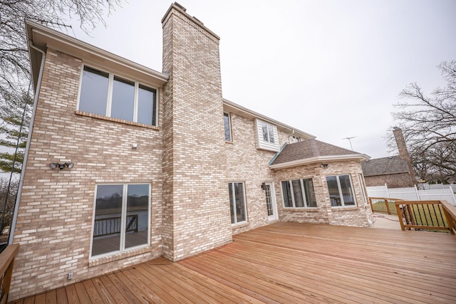 back of house with a wooden deck