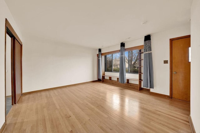 unfurnished bedroom with light hardwood / wood-style floors and a closet