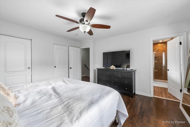 bedroom featuring ceiling fan, dark wood-type flooring, and ensuite bath