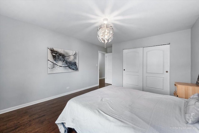 bedroom with a closet and dark wood-type flooring