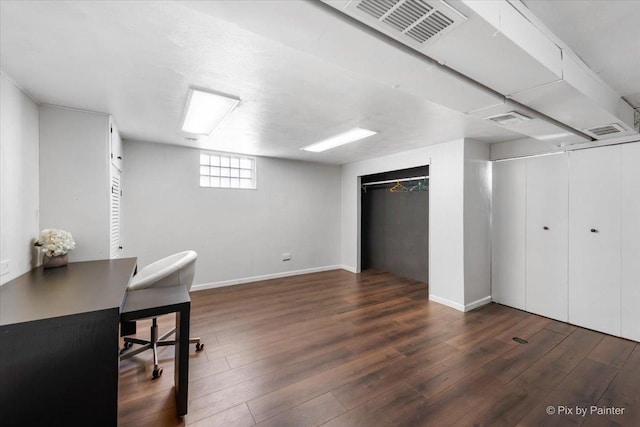 home office with dark hardwood / wood-style flooring