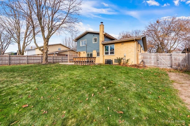 back of property featuring a yard and cooling unit