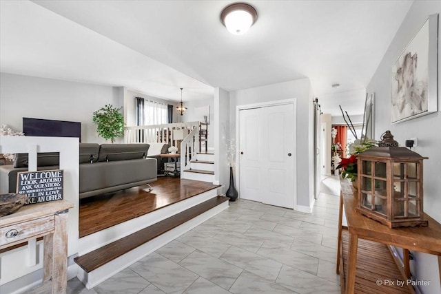 entryway featuring a chandelier