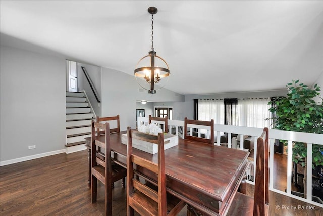 dining room with a chandelier, vaulted ceiling, and dark wood-type flooring