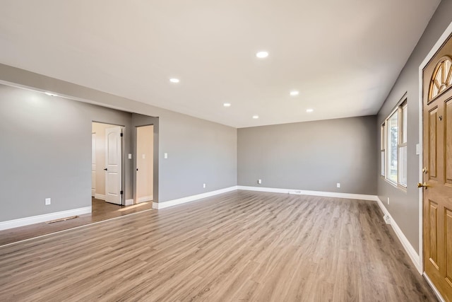 unfurnished room featuring light hardwood / wood-style flooring