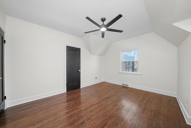 bonus room with lofted ceiling, ceiling fan, and dark wood-type flooring