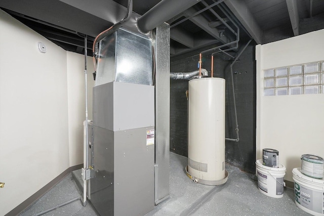 utility room with heating unit and water heater