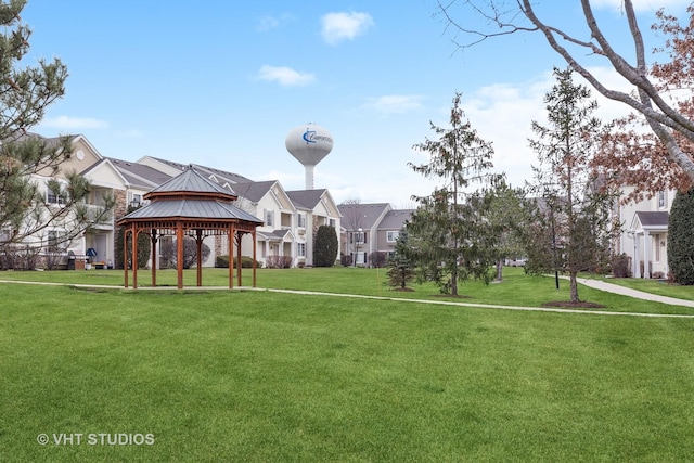 view of property's community featuring a gazebo and a lawn