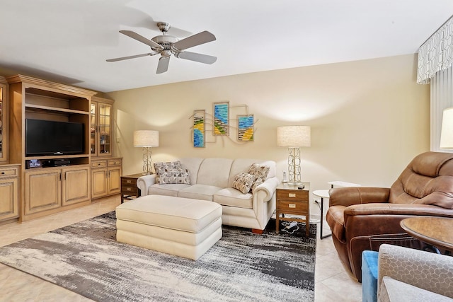 living room featuring light tile patterned floors and ceiling fan