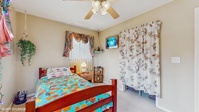 carpeted bedroom with ceiling fan