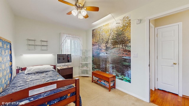 bedroom featuring ceiling fan and light hardwood / wood-style flooring