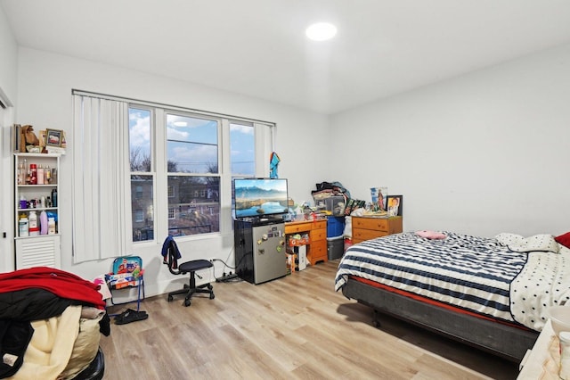 bedroom with light hardwood / wood-style flooring