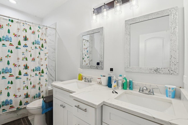 bathroom featuring a shower with shower curtain, vanity, and toilet