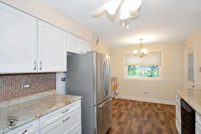 kitchen with dark hardwood / wood-style flooring, light stone counters, white cabinets, black dishwasher, and stainless steel refrigerator