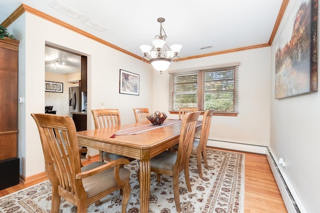 dining space with crown molding, a baseboard radiator, light hardwood / wood-style floors, and a notable chandelier