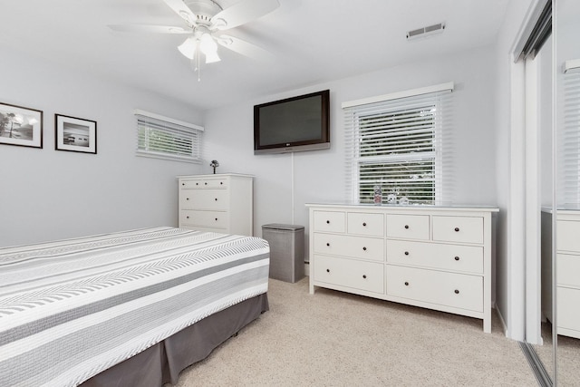 carpeted bedroom featuring ceiling fan