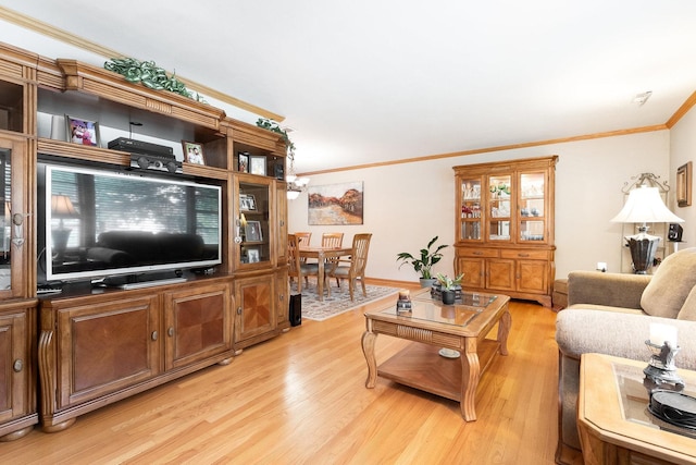 living room with light hardwood / wood-style flooring and ornamental molding