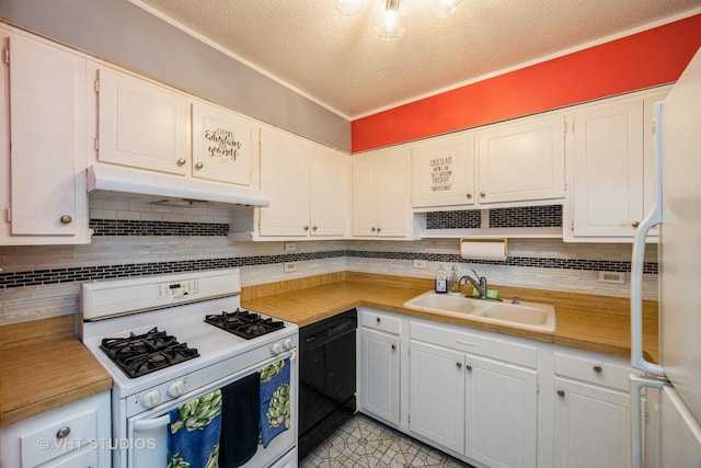 kitchen featuring a sink, white appliances, under cabinet range hood, light countertops, and decorative backsplash