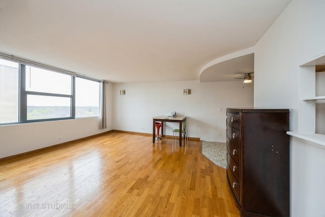spare room featuring ceiling fan and light wood-type flooring
