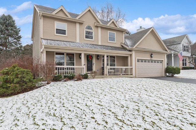 view of front of property with a porch and a garage