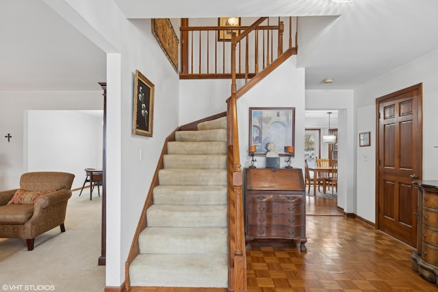 stairway with parquet flooring